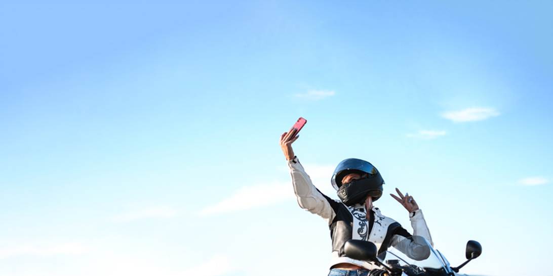 A person on a motorcycle taking a selfie
AI-generated content may be incorrect.